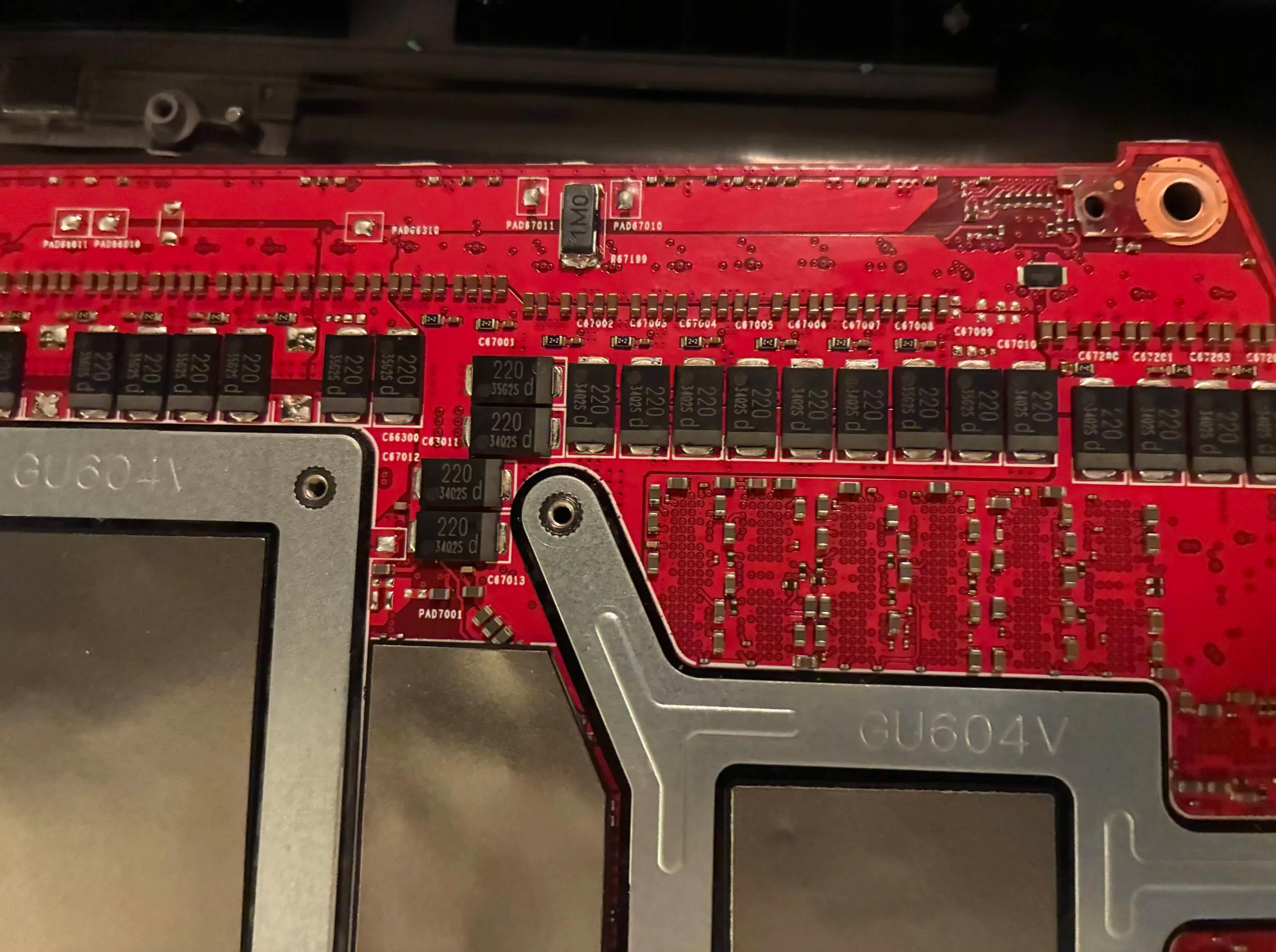 Shunt-modding an RTX 4090 laptop GPU by stacking a resistor atop an existing one