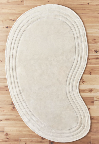 white rounded rug