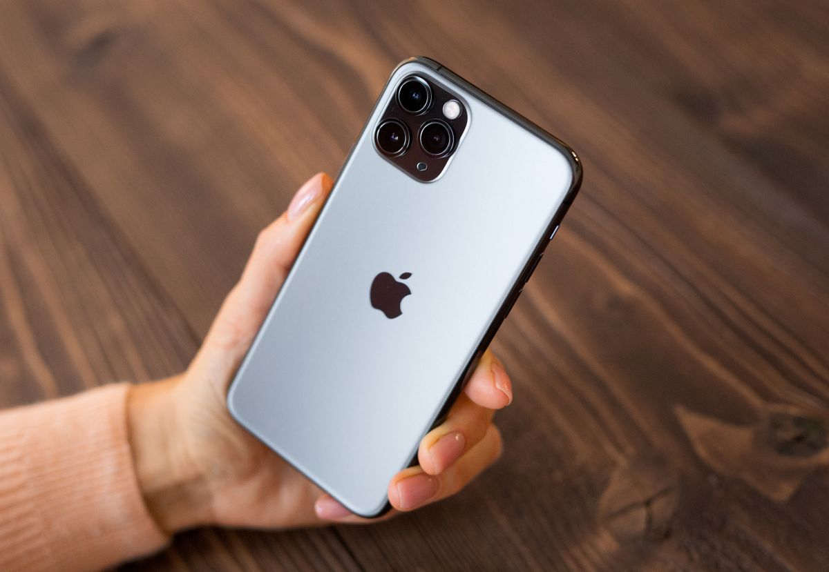 iPhone 11 Pro held in someone&amp;#039;s hand