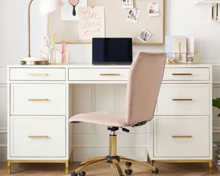 Pink office chair and laptop on desk
