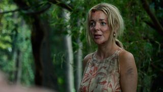 Sheridan Smith as Lori in The Castaways, standing in a leafy area looking muddy