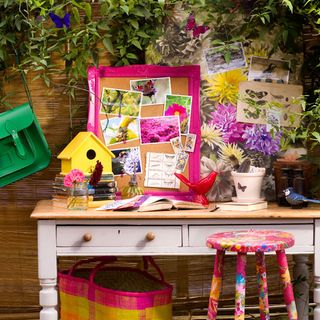 garden with garden table and printed pink stool