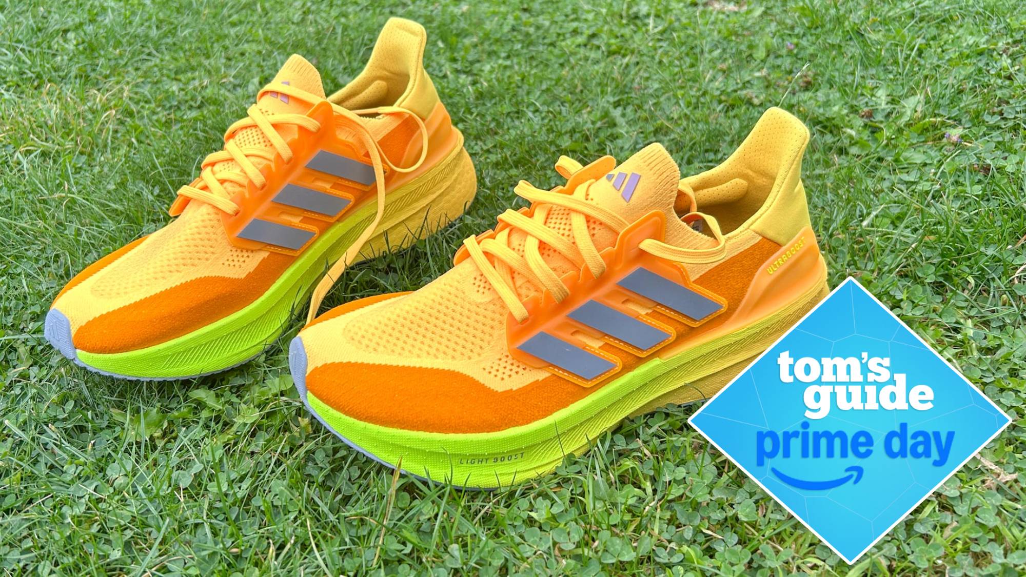 Adidas Ultraboost 5 running shoes on grass