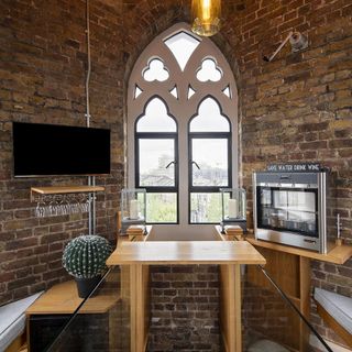 bar area with bricked wall and bar table