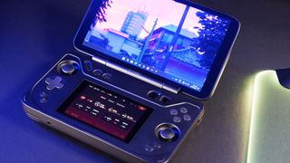 An Ayaneo Flip DS running a game while sat on a desk.