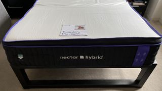 Nectar Premier Hybrid mattress on a bed frame