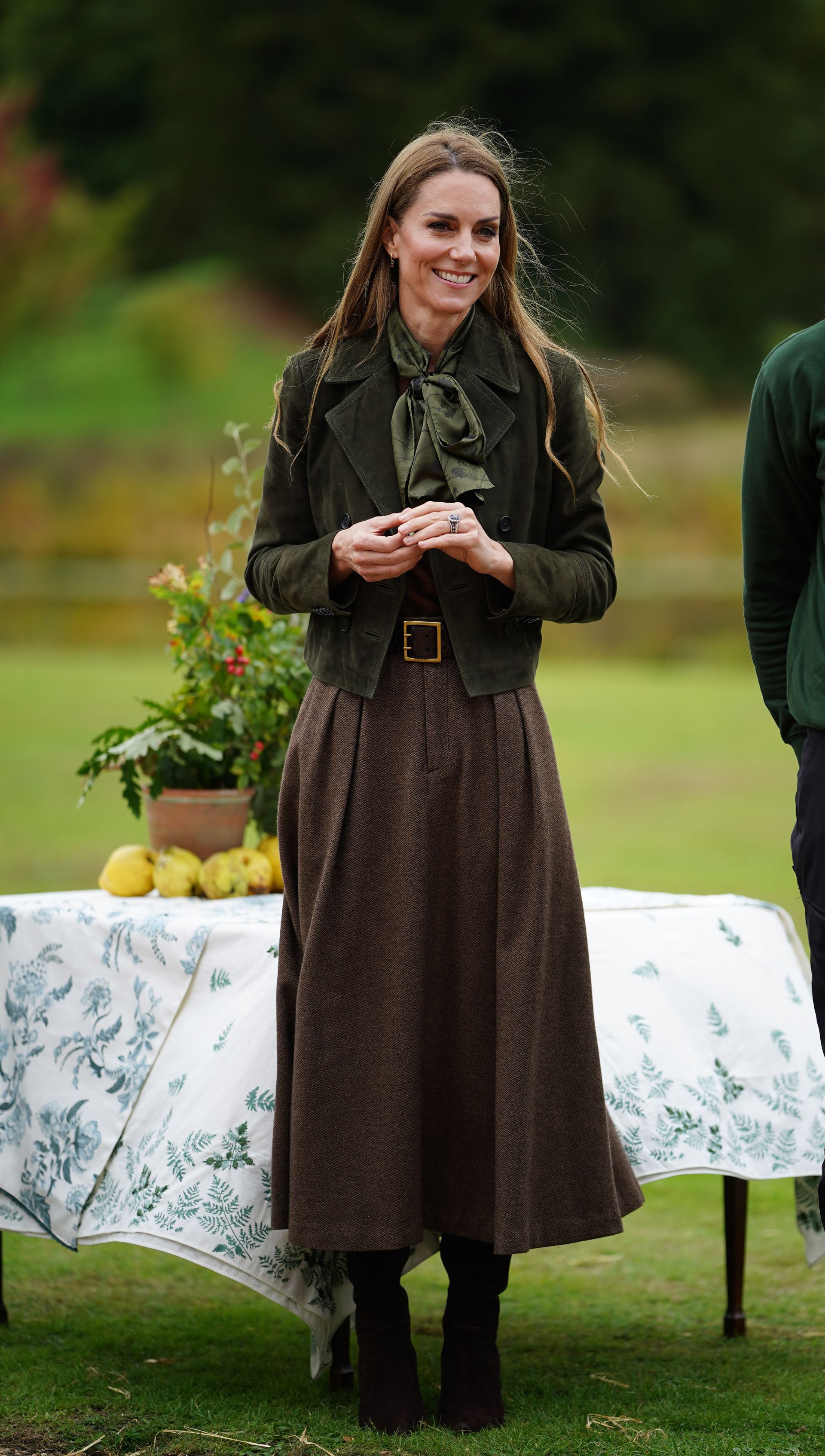 Kate Middleton wears a midi skirt with knee-high boots