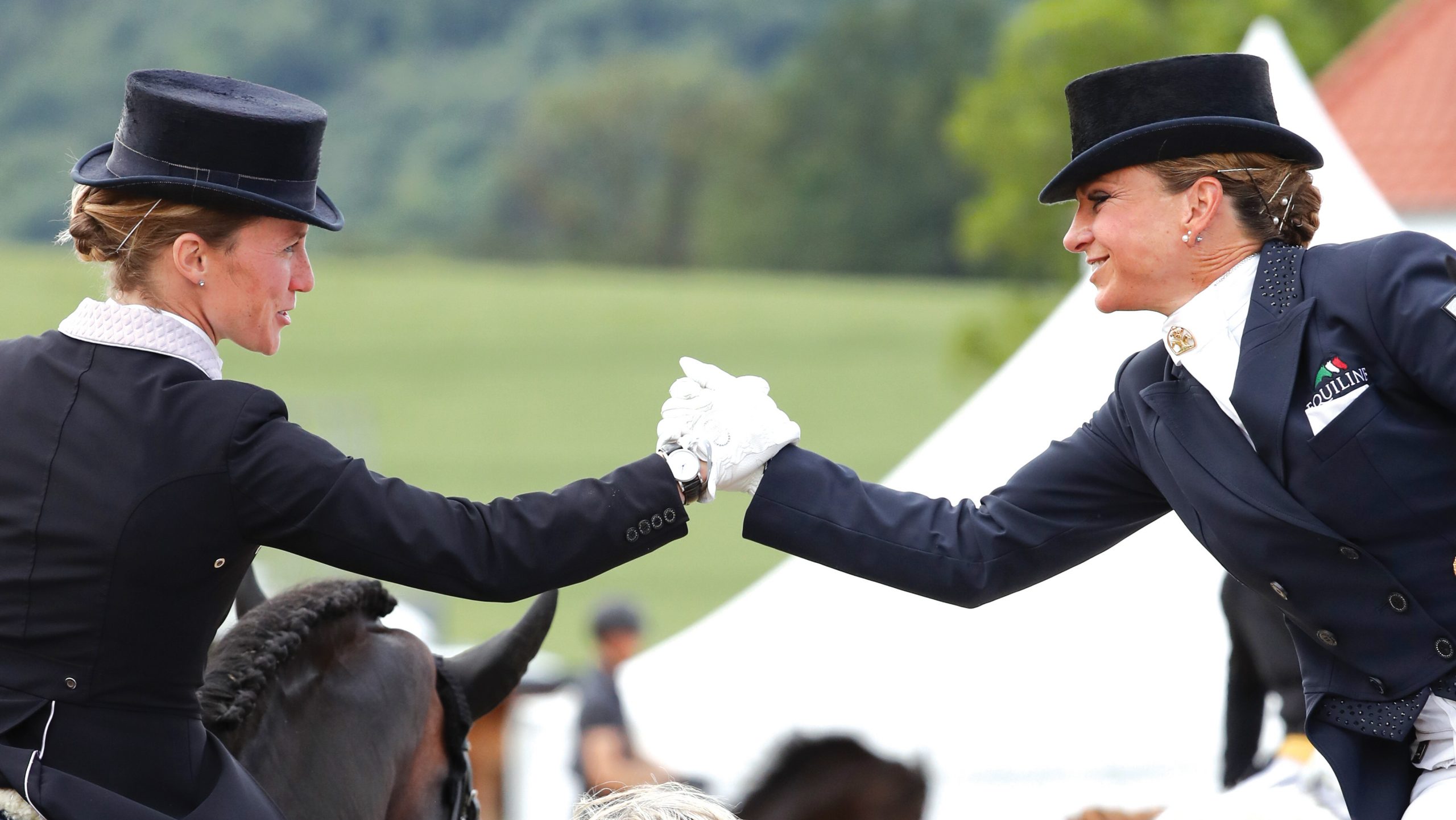 15 June 2019, North Rhine-Westphalia, Balve: Dressage rider Helen Langehanenberg (l) congratulates Dorothee Schneider on her victory at the Grand Prix Special in dressage. The German Dressage and Show Jumping Championships will take place from 13 to 16 June 2019. Photo: Friso Gentsch/dpa