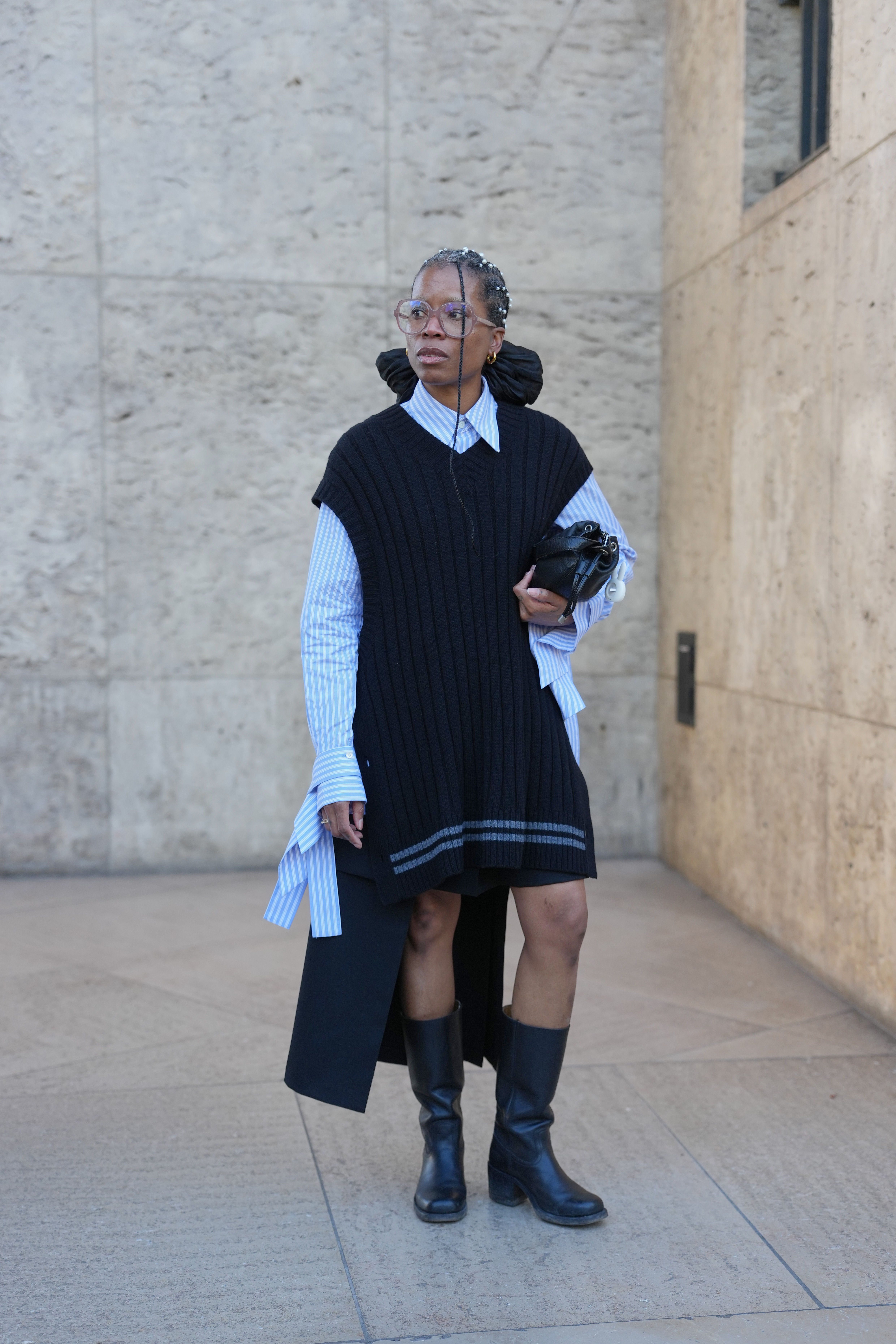 woman wearing button-down shirt, dress, and boots