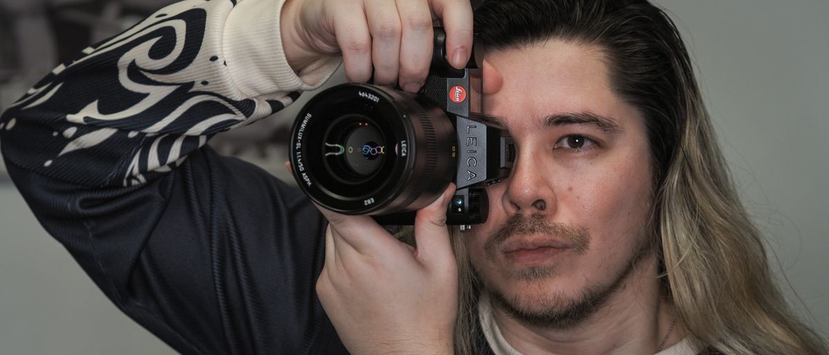 Leica SL3-S on a wooden surface with moody lighting