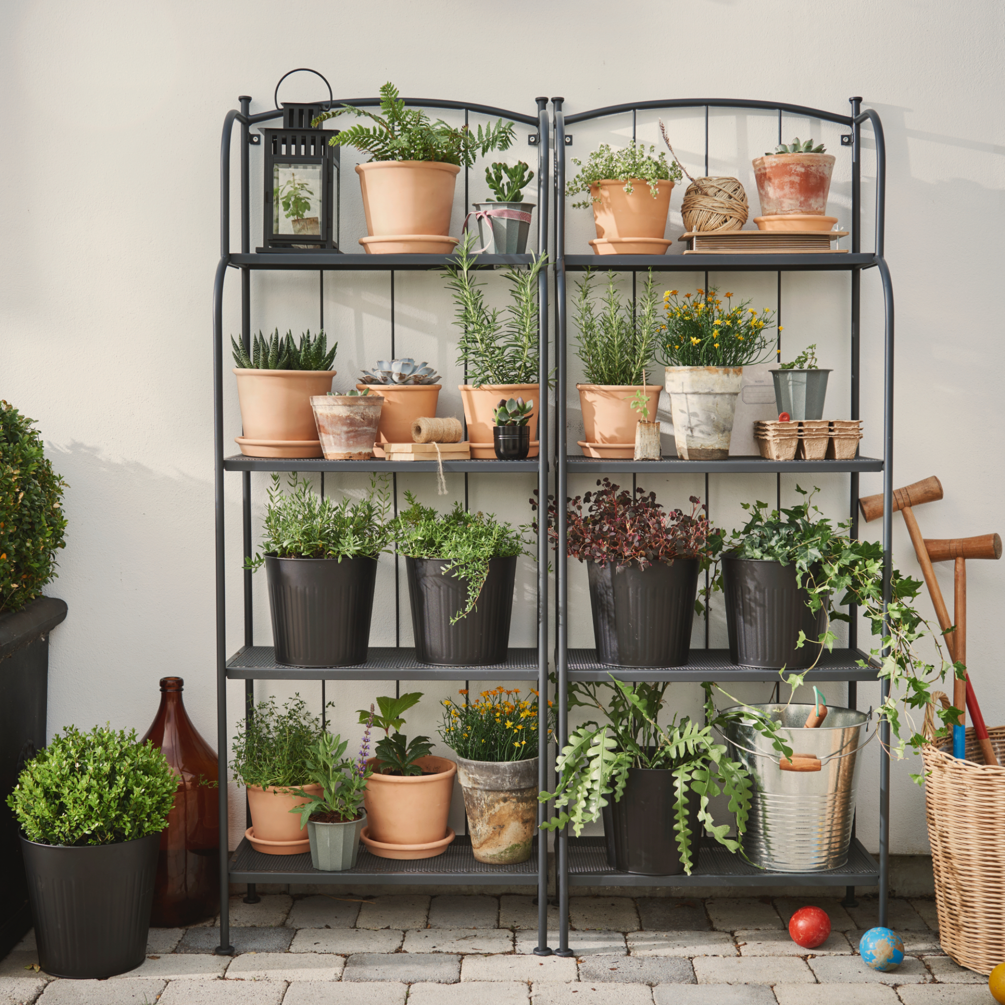 IKEA L&amp;Auml;CK&amp;Ouml; shelving units placed together with pots of different sizes