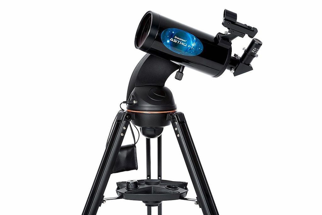 A Celestron telescope on a white background