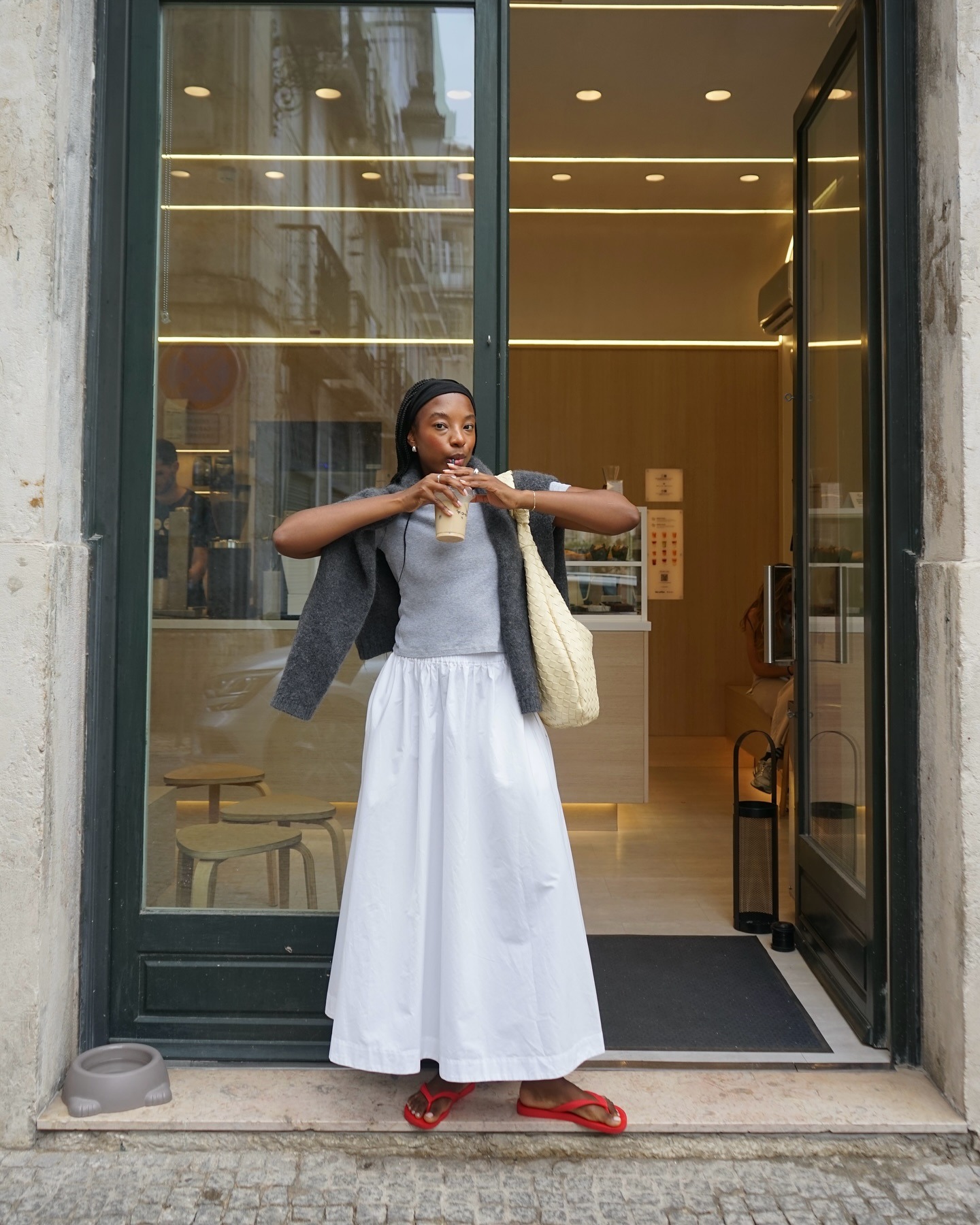 woman in black skirt and white tank