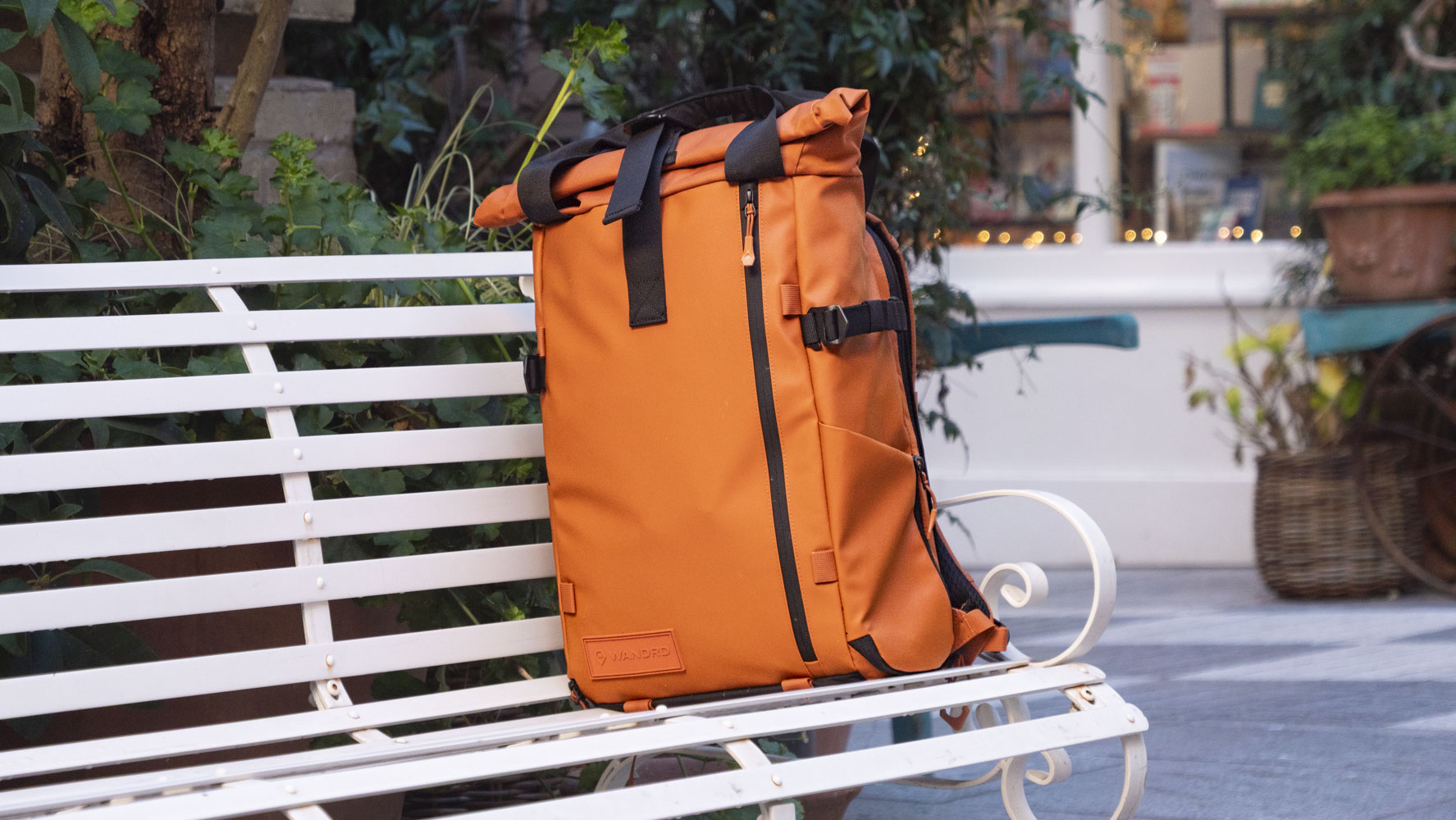 Wandrd PRVKE V4 bag on a white metal bench