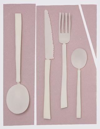 White cutlery against a pink background