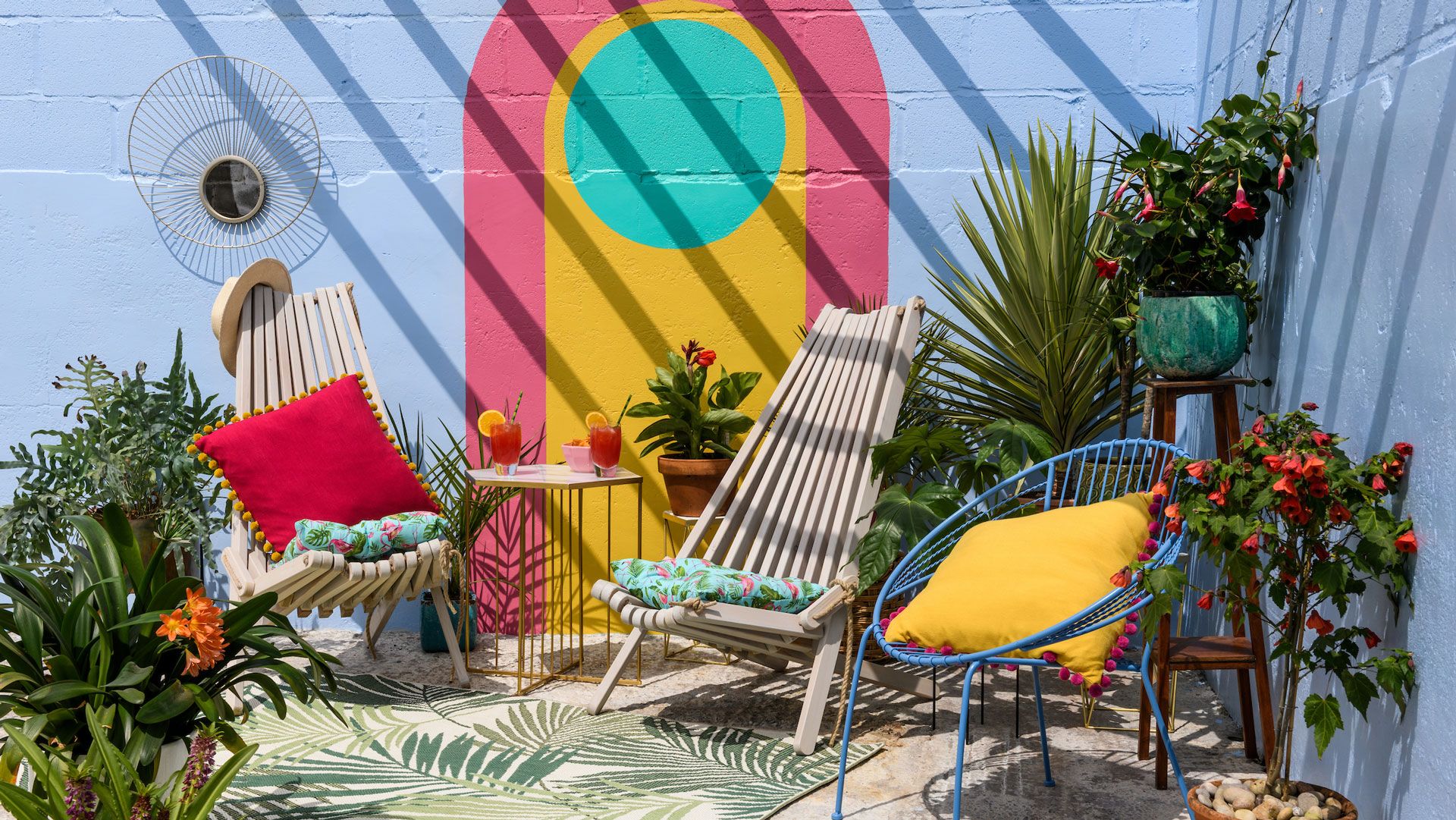 painted outdoor patio area with colourful outdoor furniture