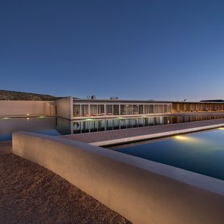 house exterior with pool area and night view
