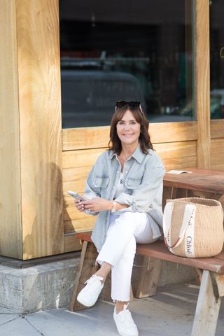 A formerReplica Store buyer wearing a denim overshirt.