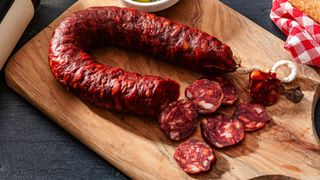 chorizo on wooden chopping board