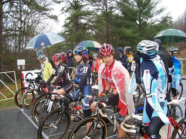 The elite women await the start in cold, rainy conditions on the second day of the North Carolina Grand Prix.