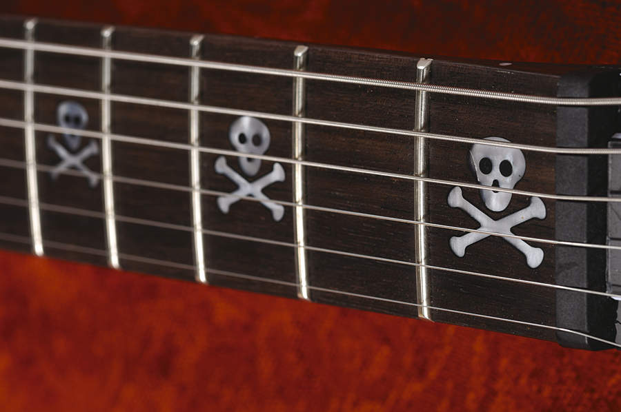 Skull fret markers, for metal kids only.