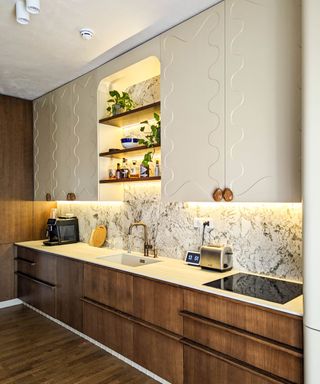 kitchen wavy textured wall cupboards and wooden under counter drawers