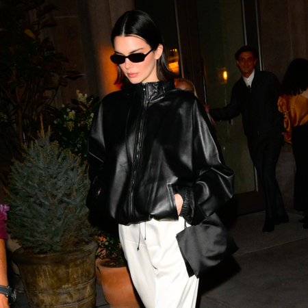 kendall jenner wearing leather jacket and sunglasses