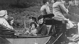 October 1937: George, Duke of Kent (1902 - 1942) with Marina, Duchess of Kent (1906 - 1968) travelling in a carriage with Princess Margaret Rose (1930 - 2002) (centre), Princess Elizabeth (left) and Queen Elizabeth, Queen Consort to King George VI (left).