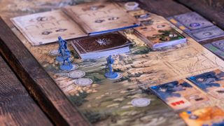 The board of The Witcher: The Path of Destiny, with miniatures placed upon it