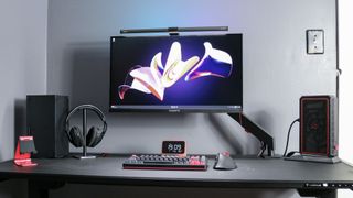 The Quntis RGB Pro+ illuminating a desk setup during the day