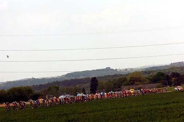 The peloton thinning out on narrow roads.