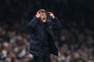 Antonio Conte directs his Tottenham players on the sidelines.