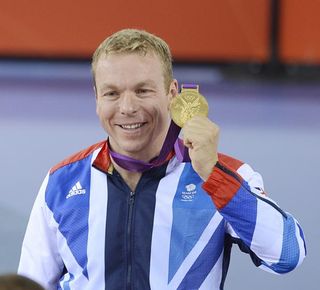 Chris Hoy (Great Britain) holds up his gold medal