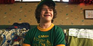 Dustin smiles in his camp shirt Stranger Things Season 3 Netflix