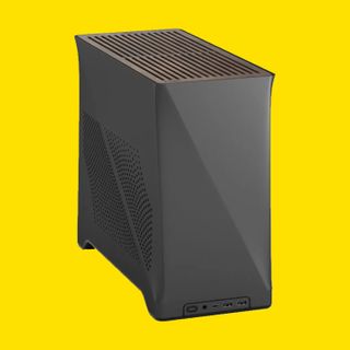 The Fractal Design Era 2 Mini-ITX PC case on a yellow background.