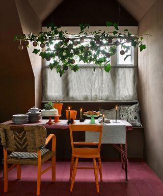 A rustic dining room with window seat and assortment of mismatched furniture painted with Annie Sloan furniture paint