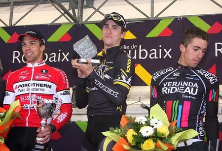 Taylor Phinney celebrates on the podium after taking a second Paris-Roubaix espoirs.