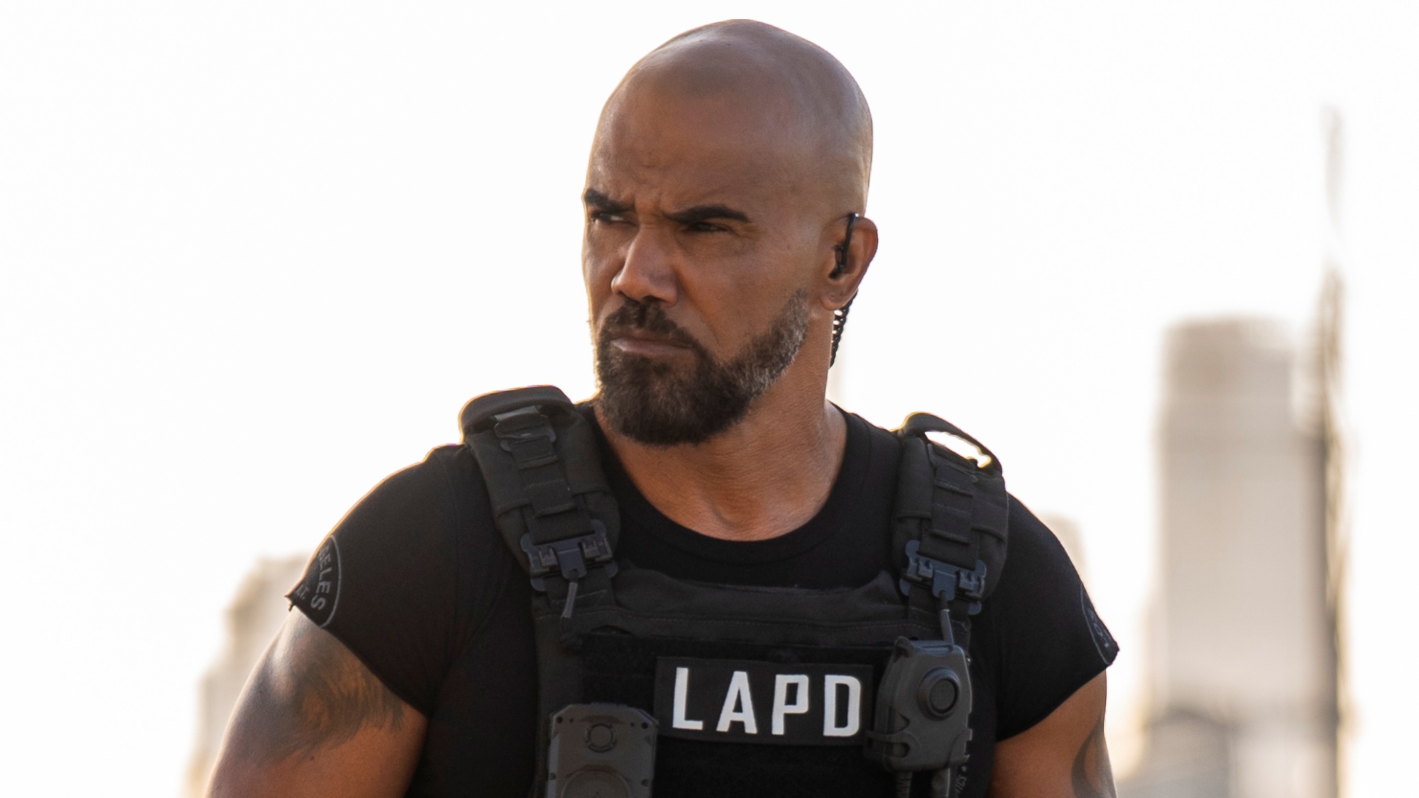 Shemar Moore as Hondo standing outside and looking serious while on a case.