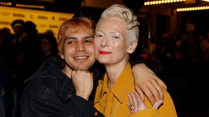 Julio Torres and Tilda Swinton embracing at the world premiere of Problemista