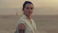 A young white woman stood against a desert backdrop.