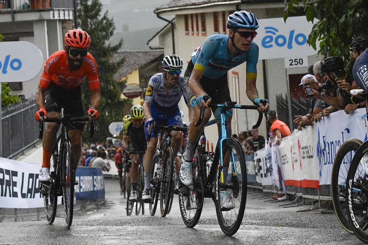 Russian road race champion Aleksandr Vlasov (Astana) climbs up through the wet streets of Barolo on his way to fourth place at the 2020 Gran Piemonte