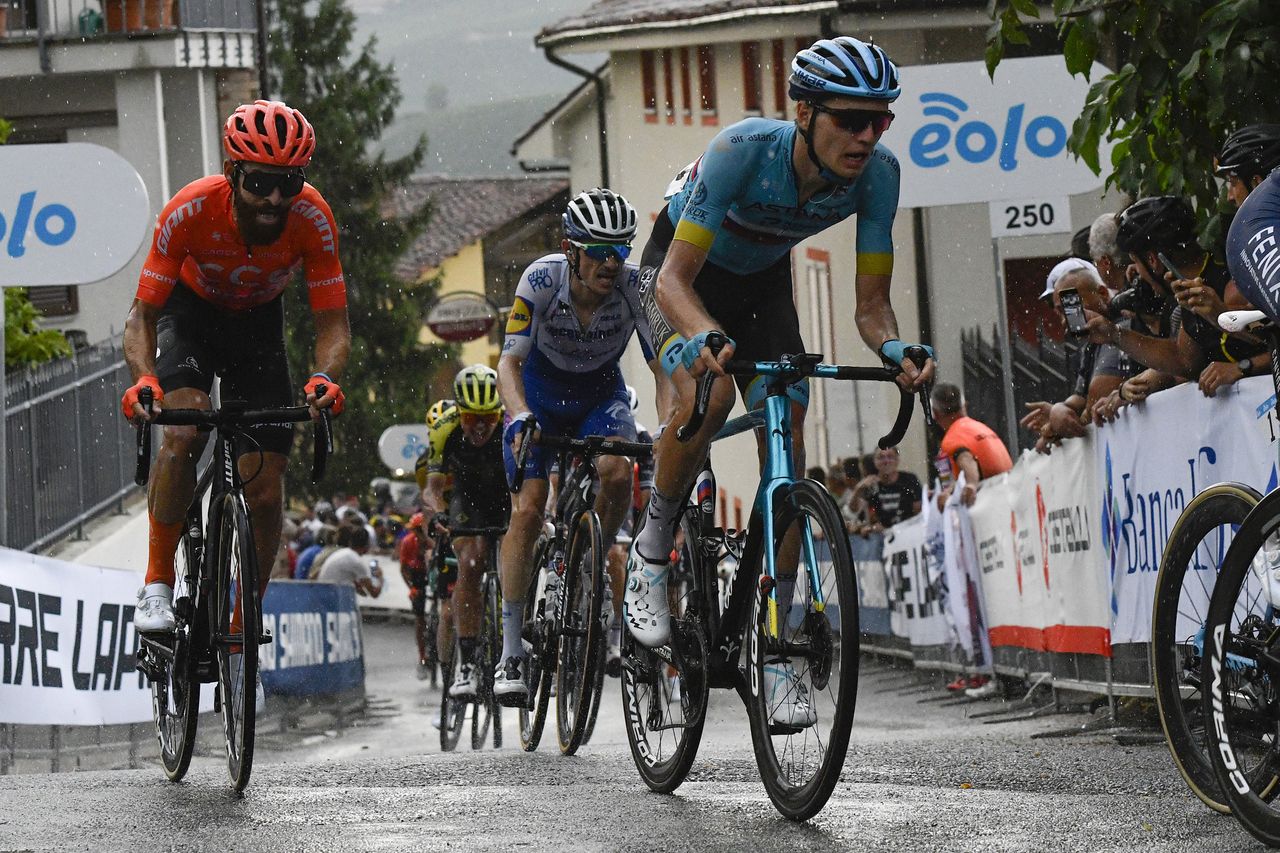 Russian road race champion Aleksandr Vlasov (Astana) climbs up through the wet streets of Barolo on his way to fourth place at the 2020 Gran Piemonte