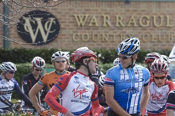 Hey Brooksy, what about a game of golf after the stage today? Cameron Peterson (Virgin Blue/RBS Morgan) shares a joke with Brendan Brooks (r) of Shortis.com.au on the startline in Warragul.