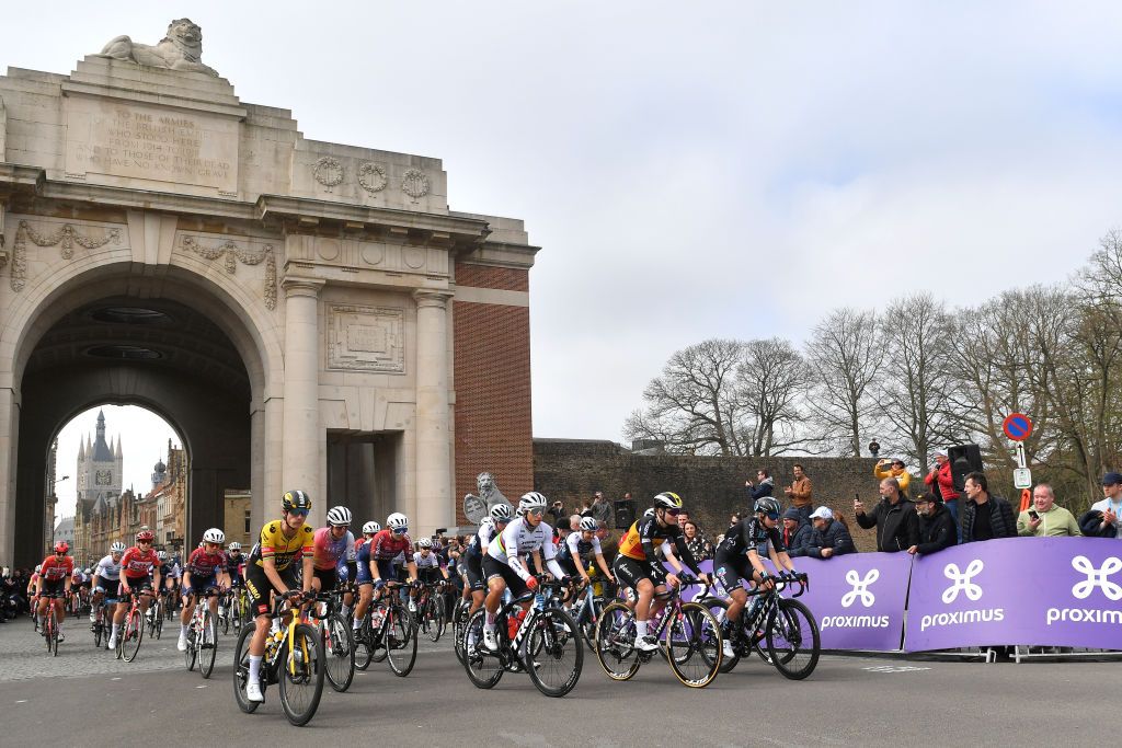 WEVELGEM BELGIUM MARCH 27 LR Marianne Vos of Netherlands and Jumbo Visma Team Elisa Balsamo of Italy and Team Trek Segafredo Lotte Kopecky of Belgium and Team SD Worx Gaia Masetti of Italy and Ag Insurance Nxtg Team and the peloton at Menin Gate Menenpoort prior to the during the 11th GentWevelgem In Flanders Fields 2022 Womens Elite a 159km one day race from Ypres to Wevelgem GWEwomen UCIWWT on March 27 2022 in Wevelgem Belgium Photo by Luc ClaessenGetty Images