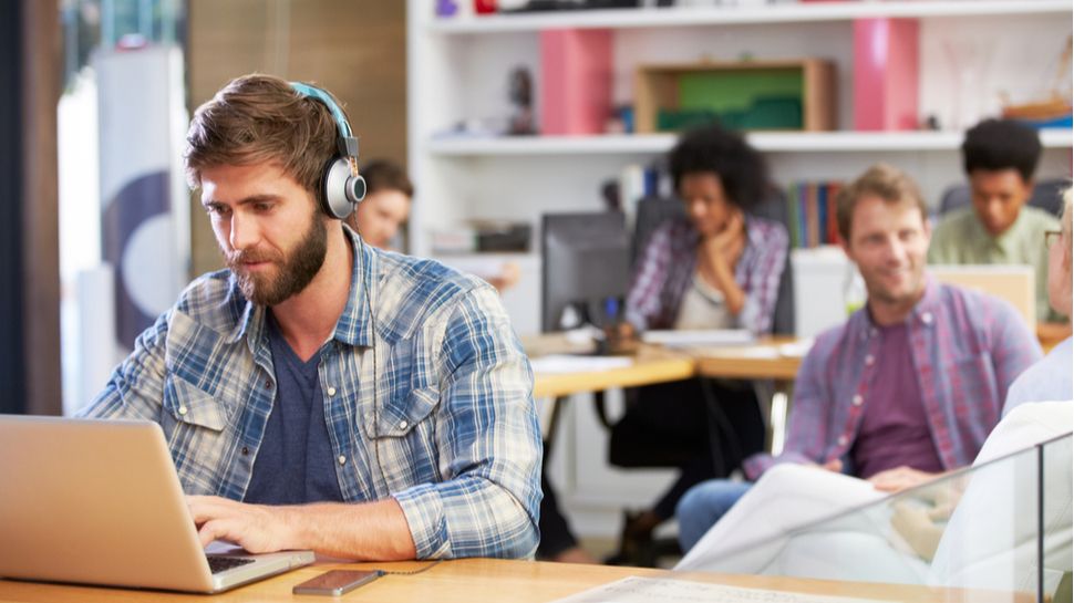 man working with headphones