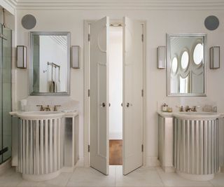 Twin sinks and mirrors, glass shower