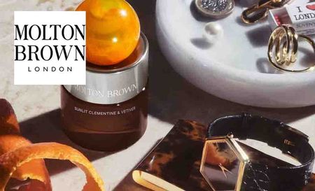 molton brown logo top left with a close up of molton brown products with jewellery 