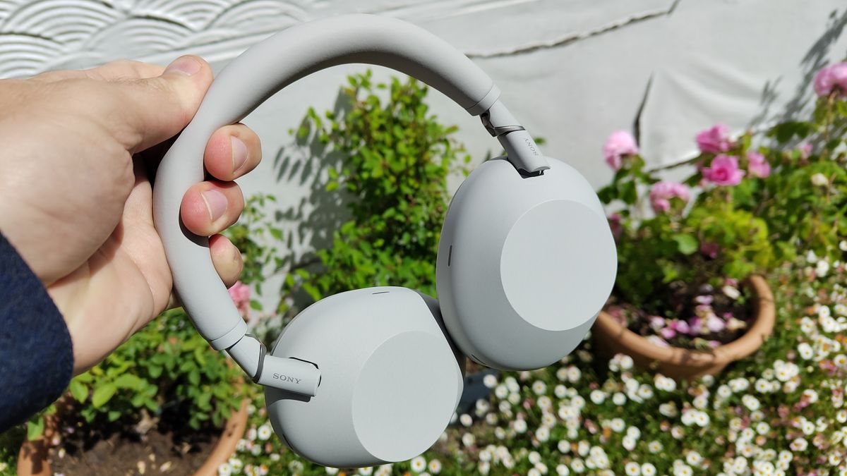 Sony WH-1000XM6 in white held in the hand