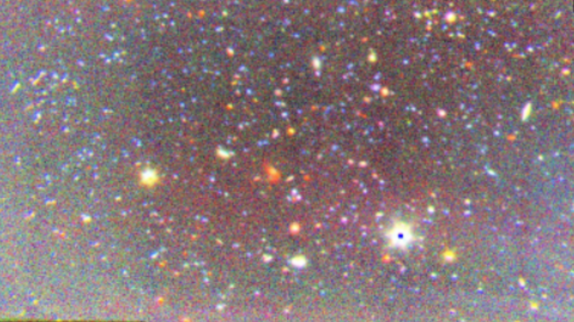 wisps of colored light on a black background