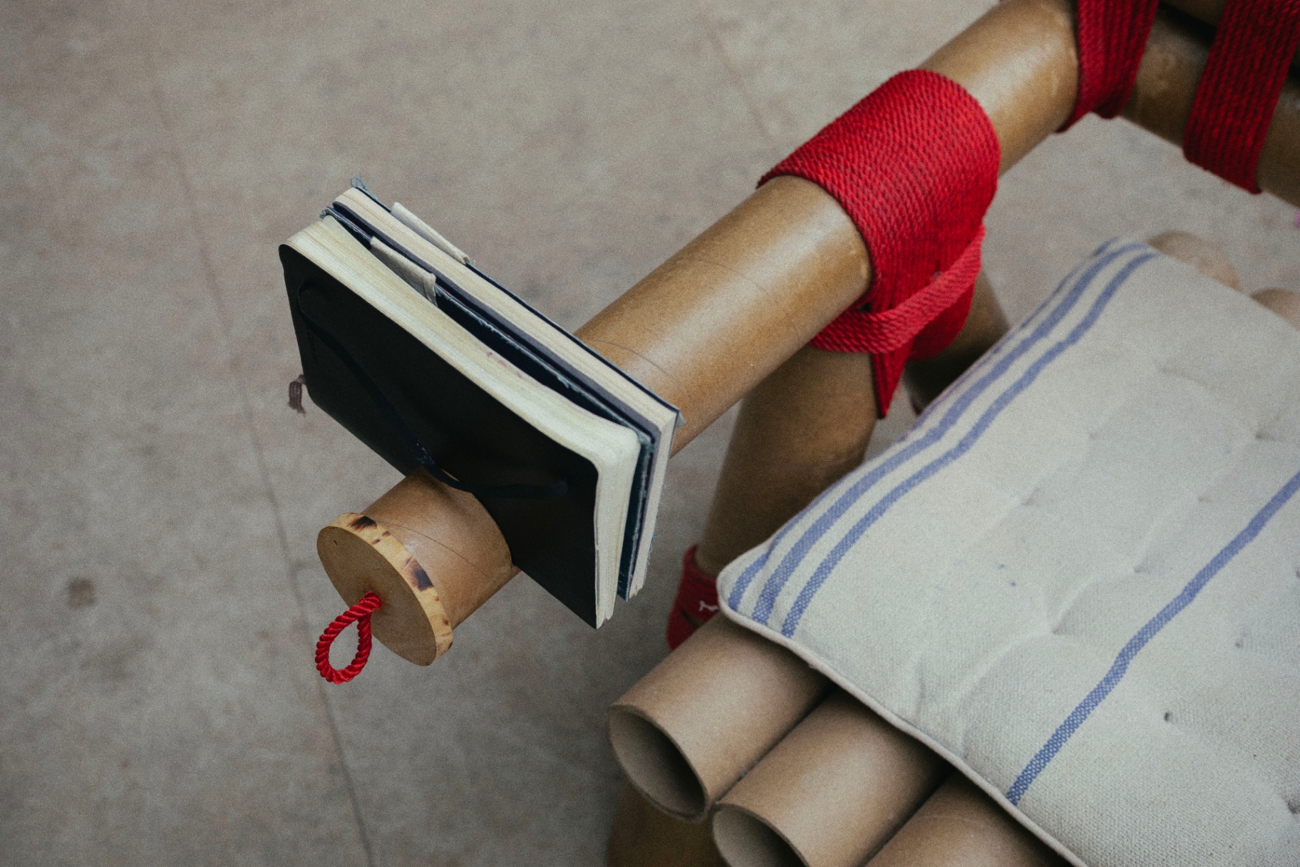 chair made from cardboard tubes tied together with rope